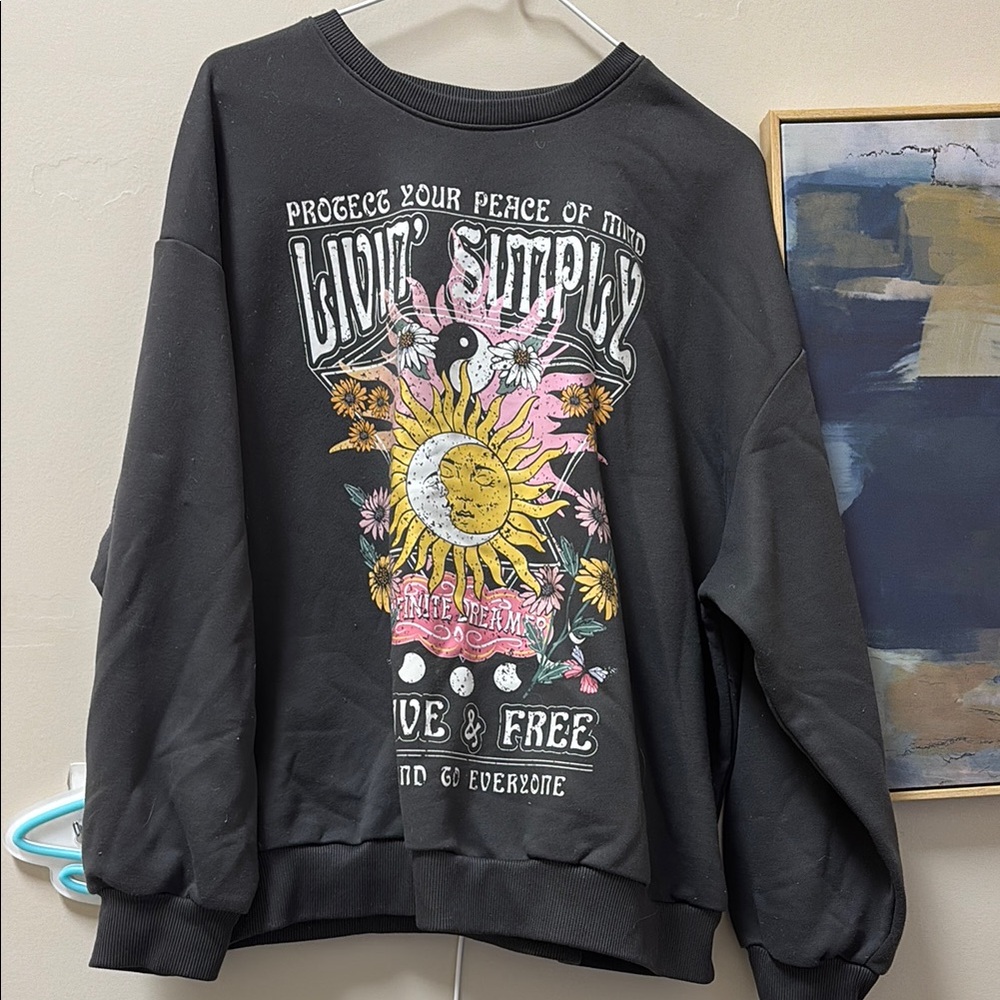 Black Graphic Sweatshirt with Sun and Floral Design